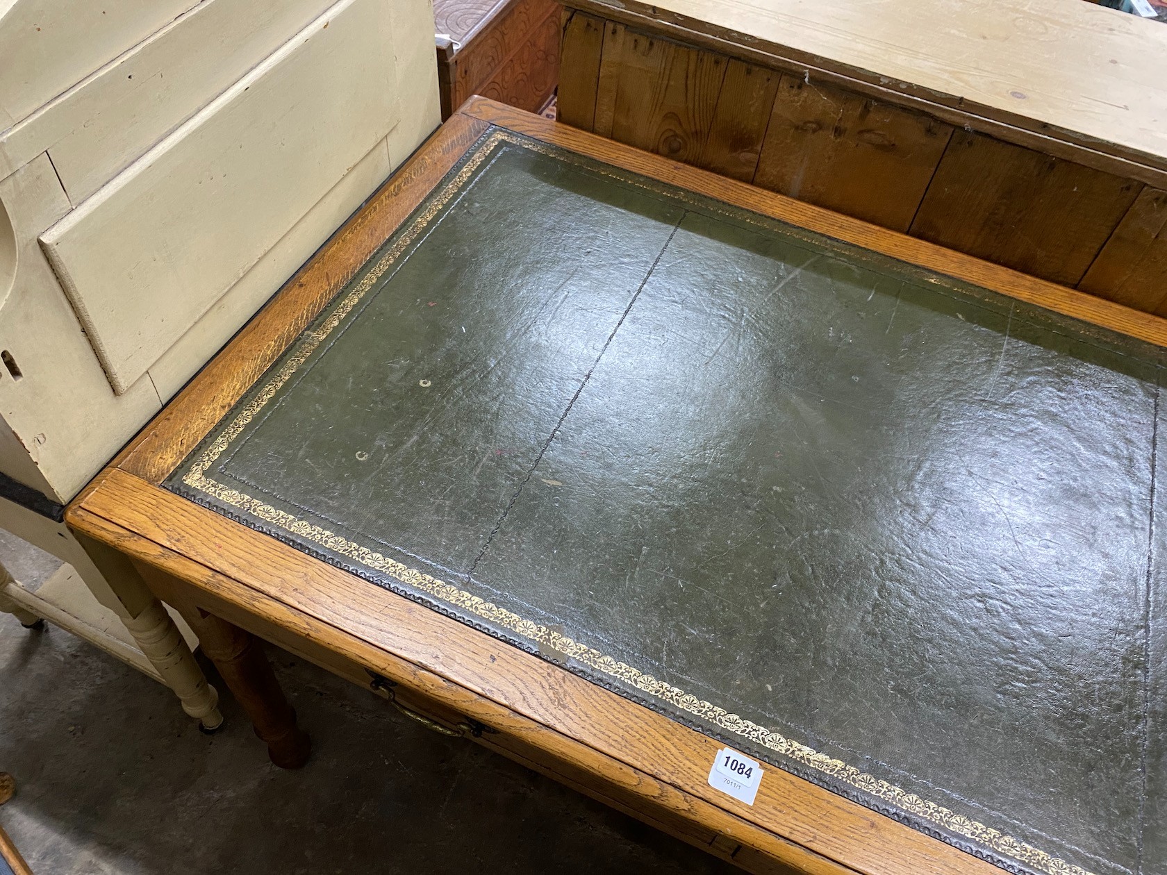 An early 20th century oak writing table, width 137cm